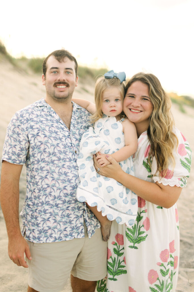 Small family coordinating outfits on the beach in Duck, NC