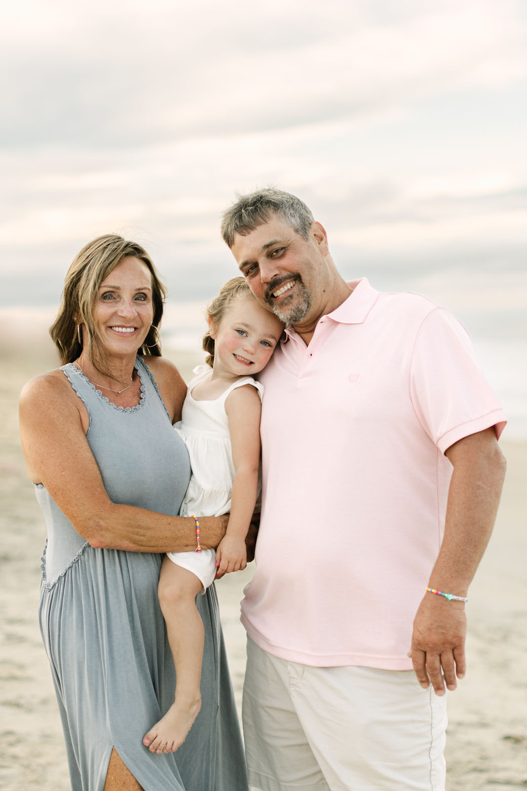 grandparents with granddaughter at the  Corolla nc beach