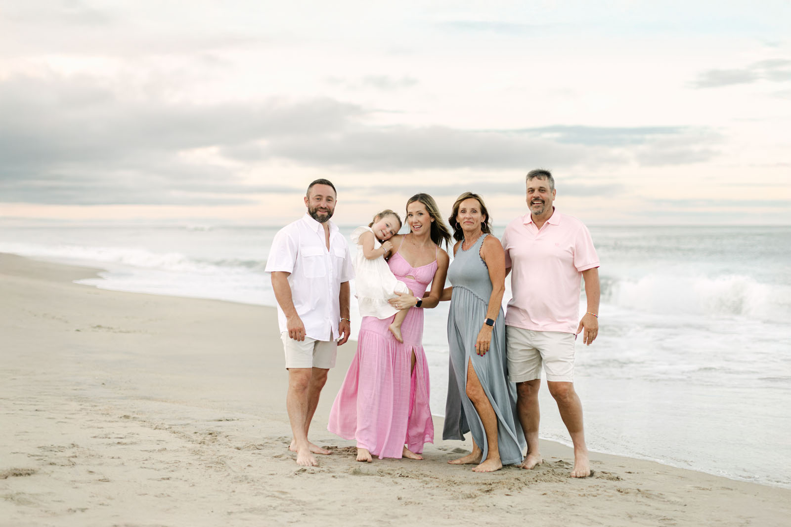 family photo session at corolla nc beach: grandparents, parents, child