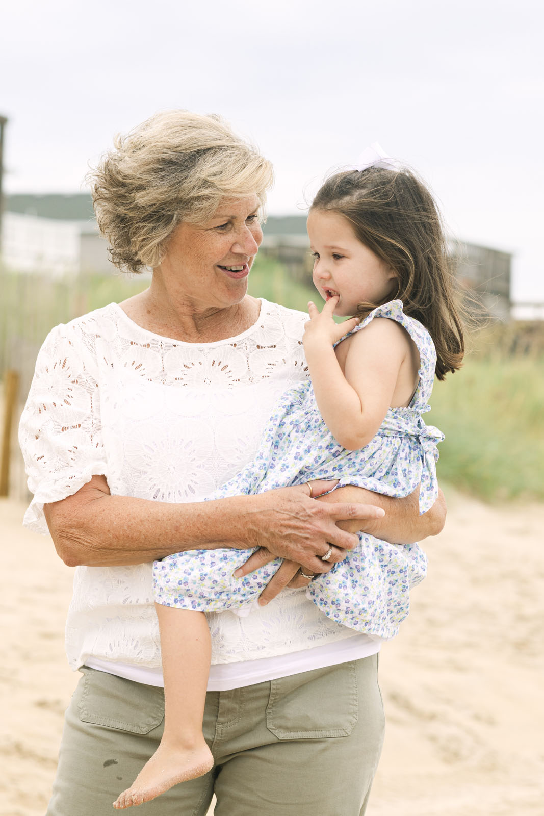 Grandmother holding her granddaughter during a family photo session