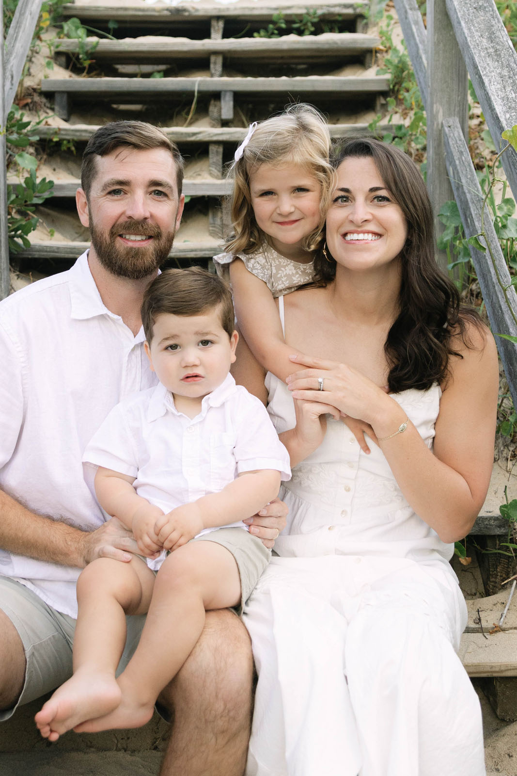 Close up photo of parents and their children during a beach session in Kitty Hawk