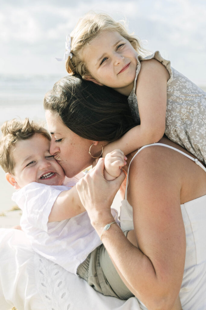 Outer Banks family photographer capturing candid beach moments in Kitty Hawk